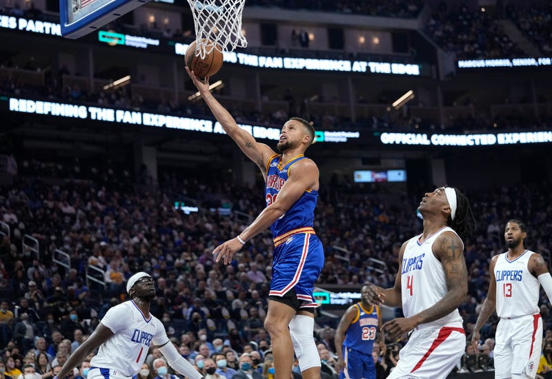 Stephen Curry #30 of the Golden State Warriors shoots and scores against the LA Clippers during the first quarter at Chase Center on October 21, 2021 in San Francisco, California. 
