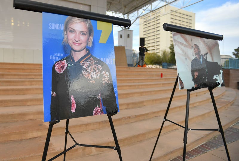 Photos of cinematographer Halyna Hutchins are displayed before a vigil held to honor her at Albuquerque Civic Plaza on October 23, 2021 in Albuquerque, New Mexico. Hutchins was killed on set while filming the movie "Rust" at Bonanza Creek Ranch near Santa Fe, New Mexico on October 21, 2021. The film's star and producer Alec Baldwin discharged a prop firearm that hit Hutchins and director Joel Souza. (Photo by Sam Wasson/Getty Images)