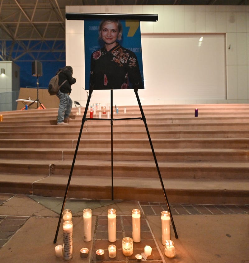 Candles are placed in front of a photo of cinematographer Halyna Hutchins during a vigil held in her at Albuquerque Civic Plaza on October 23, 2021 in Albuquerque, New Mexico.