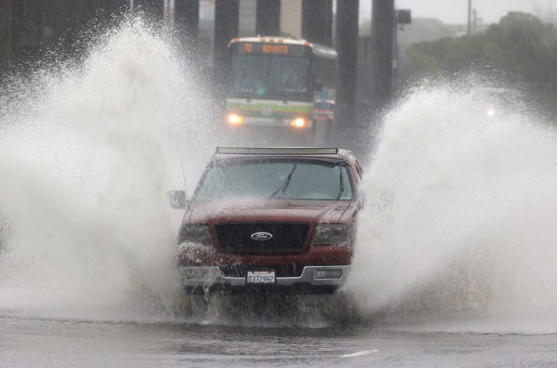 Water kicks up as a truck drives on a flooded street on October 24, 2021 in Mill Valley, California.