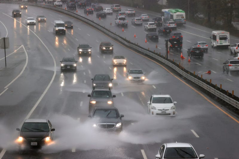 Cars drive through flooded a section of Highway 101 on October 24, 2021 in Corte Madera, California. 