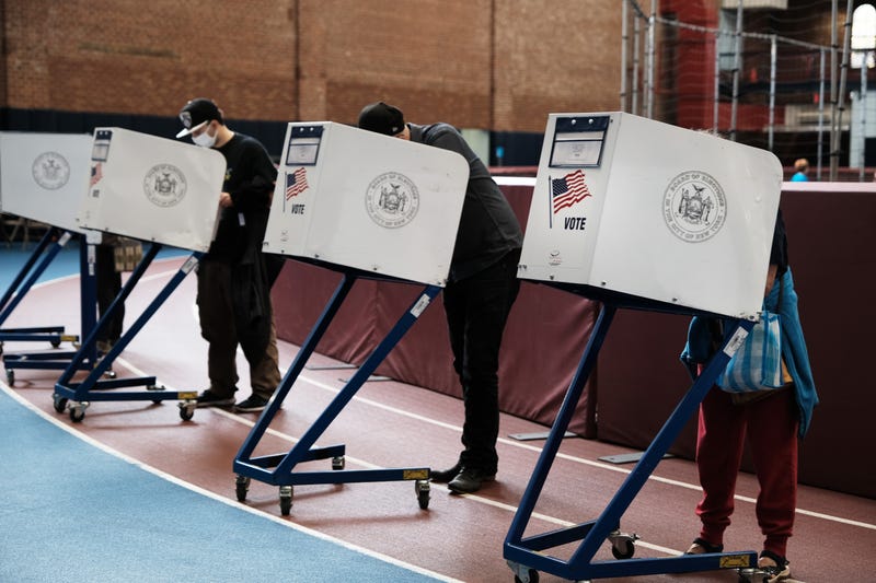File photo: People visit an early voting site at a YMCA in Brooklyn on October 25, 2021 in New York City