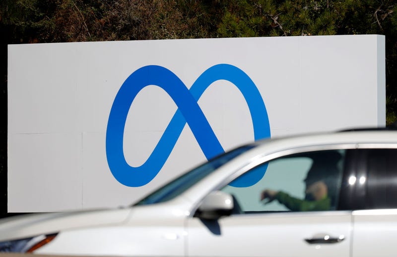 A car drives by a new logo and the name 'Meta' on the sign in front of Facebook headquarters on October 28, 2021 in Menlo Park, California. A new name and logo were unveiled at Facebook headquarters after a much anticipated name change for the social media platform. (Photo by Justin Sullivan/Getty Images)