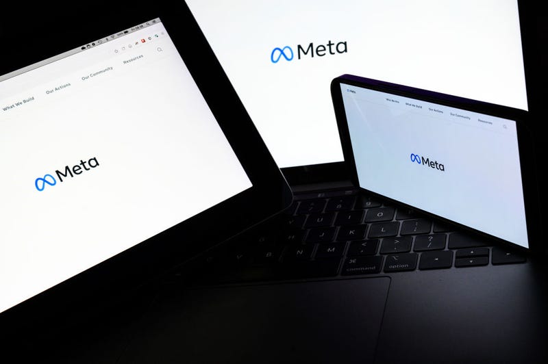 In this photo illustration, three screens display the splash page for the Meta page on the facebook website on October 29, 2021 in London, England. The Facebook company, which owns Facebook, Whatsapp and Instagram, has announced that it is rebranding, changing it's name to "Meta". (Photo by Leon Neal/Getty Images)