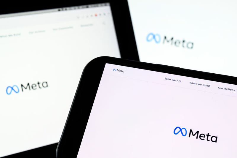 In this photo illustration, three screens display the splash page for the Meta page on the facebook website on October 29, 2021 in London, England.
