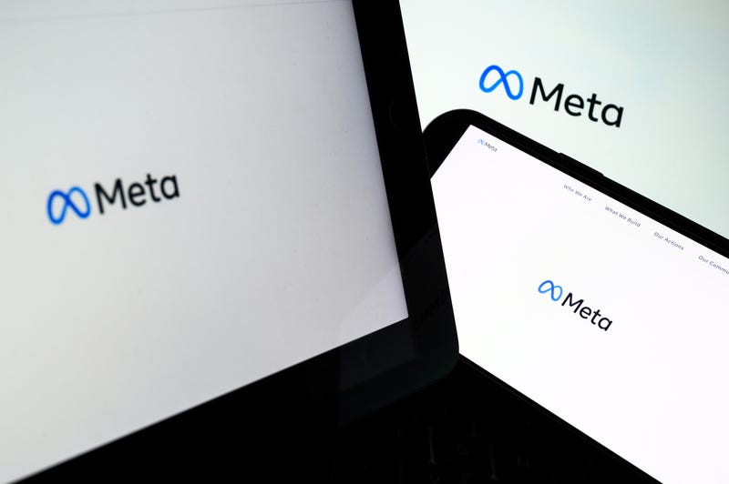 Three screens display the splash page for Meta, Facebook and Instagram's parent company, in London, England.
