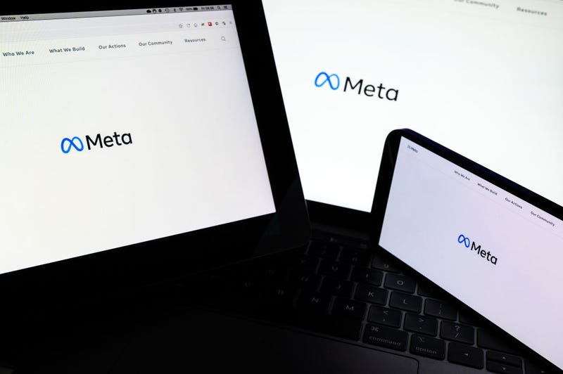 In this photo illustration, three screens display the splash page for the Meta page on the facebook website on October 29, 2021 in London, England. 