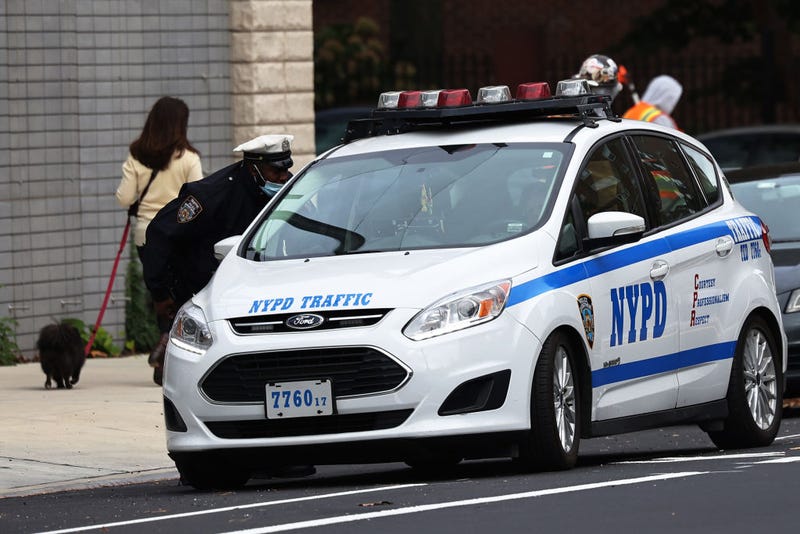NYPD traffic officers have a conversation on October 29, 2021 in Downtown Brooklyn in New York City.