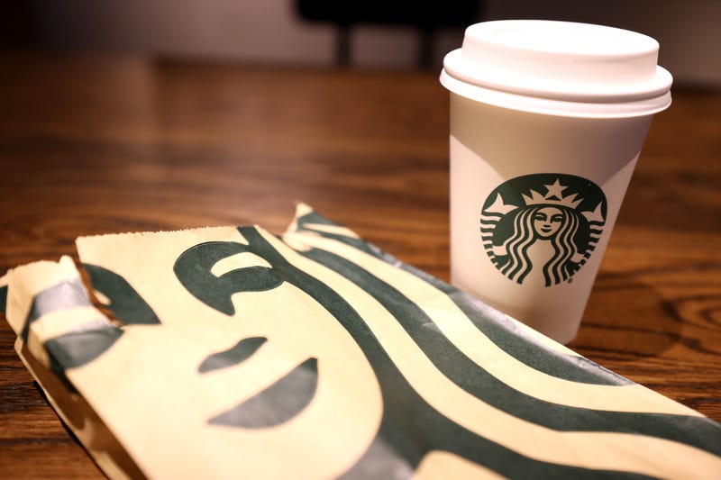 The Starbucks logo is display on a cup and bag at a Starbucks store on October 29, 2021 in San Francisco, California.
