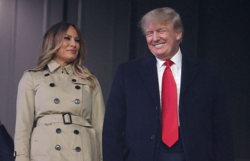 Former first lady and president of the United States Melania and Donald Trump look on prior to Game Four of the World Series between the Houston Astros and the Atlanta Braves Truist Park on October 30, 2021 in Atlanta, Georgia. (Photo by Elsa/Getty Images)