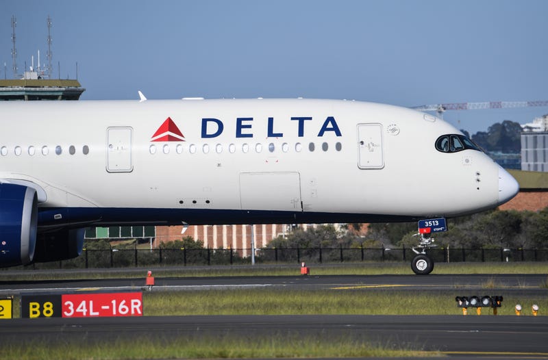 SYDNEY, AUSTRALIA - OCTOBER 31: A Delta airlines aircraft landing from Los Angeles at Kingsford Smith International airport on October 31, 2021 in Sydney, Australia. Australia's COVID-19 border restrictions will ease from Monday 1 November to allow quarantine-free travel. Fully vaccinated international travellers into New South Wales and Victoria will no longer be required to enter mandatory hotel quarantine. Australian citizens will also be able to leave the country without requiring a travel exemption. Prior to the restrictions lifting on 1 November, all international arrivals are required to complete 14-days of mandatory hotel quarantine.