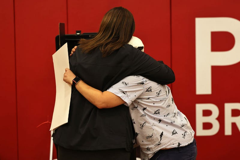 New York Attorney General and gubernatorial candidate Letitia James hugs an election worker as she prepares to file her ballot on Election Day at P.S. 11 Purvis J. Behan Elementary on November 02, 2021 in the Clinton Hill neighborhood of Brooklyn borough in New York City. New Yorkers head to the polls today to decide who will become the 110th mayor of NYC. Democratic mayoral candidate Eric Adams is the frontrunner ahead of Republican candidate Curtis Sliwa.