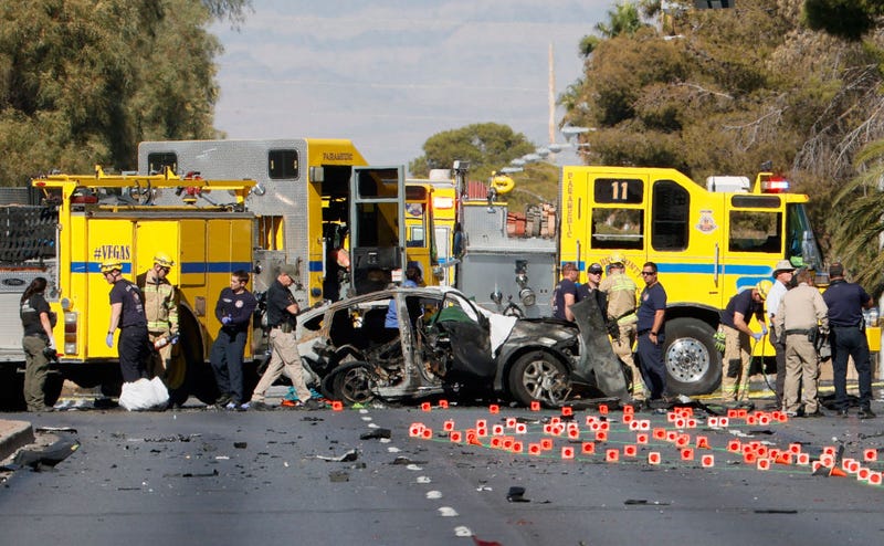Members of the Clark County Fire Department and the Las Vegas Metropolitan Police Department work the scene of a fatal accident on November 2, 2021.