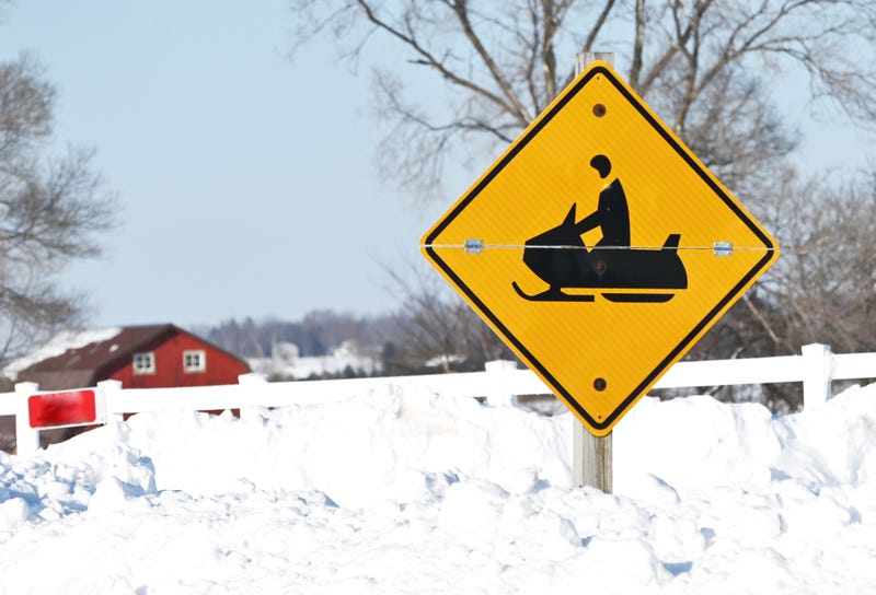 snowmobile crossing sign in a stock image 