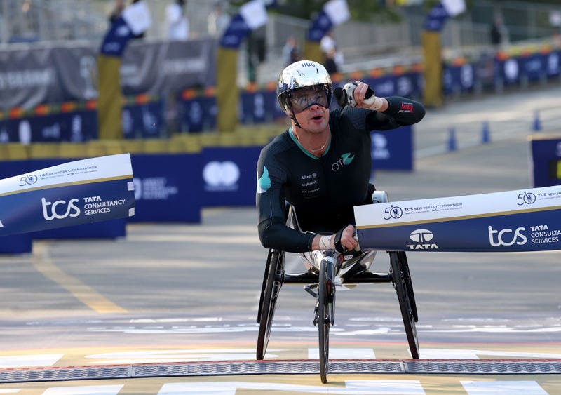 Marcel Hug of Switzerland celebrates as he wins the Men's Wheelchair during the 2021 TCS New York City Marathon in Central Park on November 07, 2021 in New York City.
