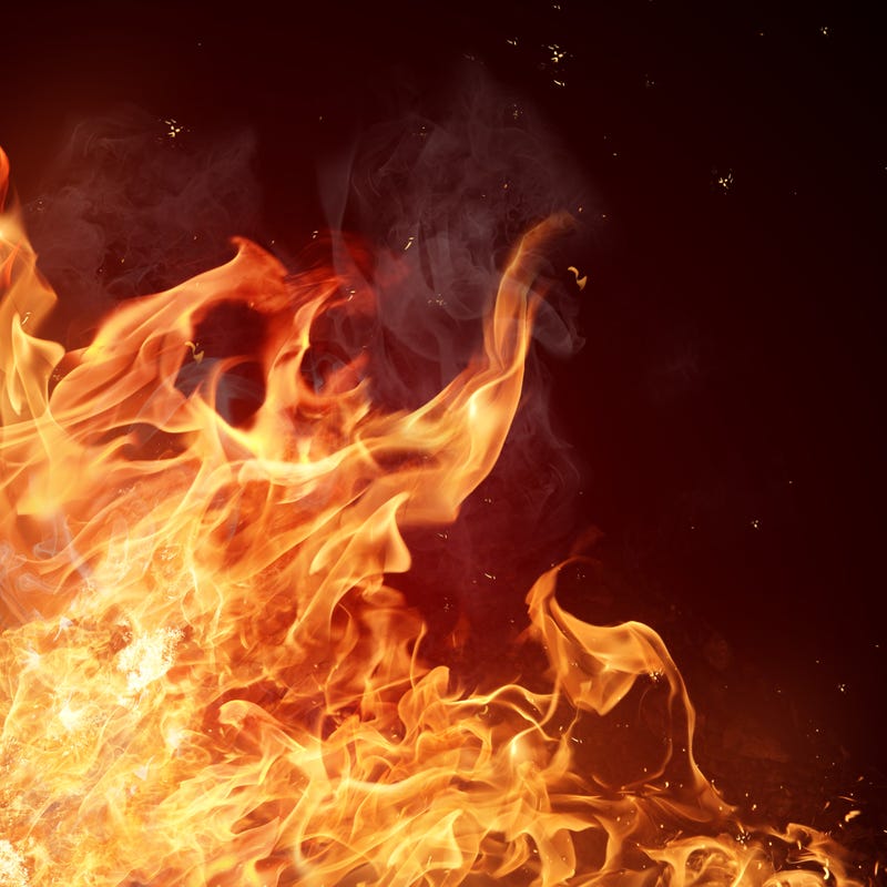 Fire burns inside of a home