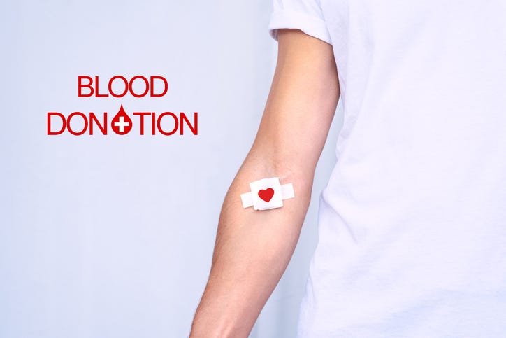 Blood donor with bandage after giving blood