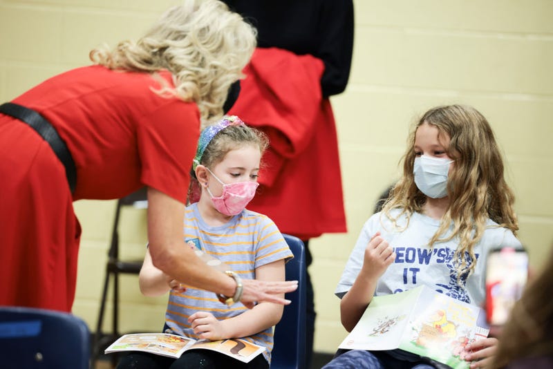 U.S. First Lady Dr. Jill Biden gives stickers to children who were just vaccinated in an observation room of a pediatric COVID-19 vaccination clinic at the Franklin Sherman Elementary School on November 08, 2021 in Mclean, Virginia. Dr. Biden visited the school with U.S. Surgeon General Dr. Vivek Murthy to help promote COVID-19 vaccinations efforts for kids aged 5-1. (Photo by Anna Moneymaker/Getty Images)