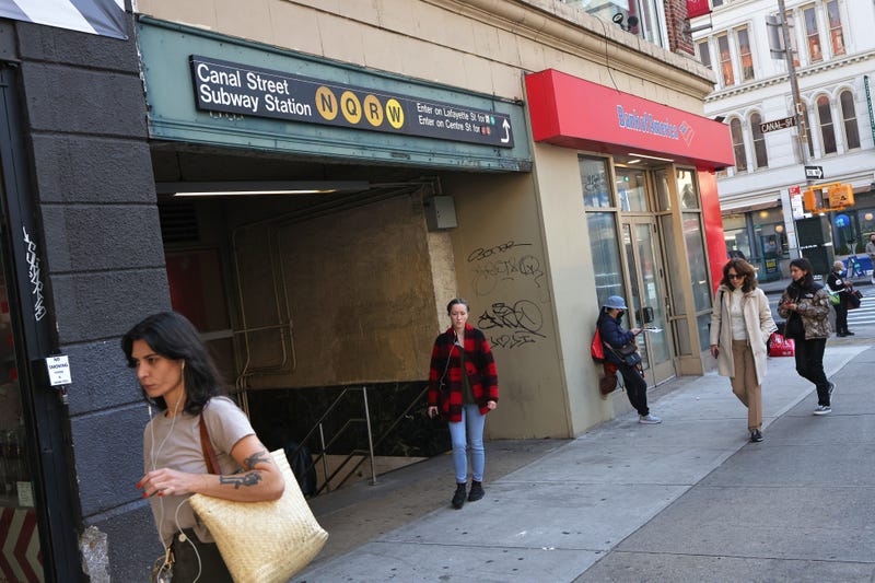 People walk past the Canal Street Station on November 09, 2021 in New York City.