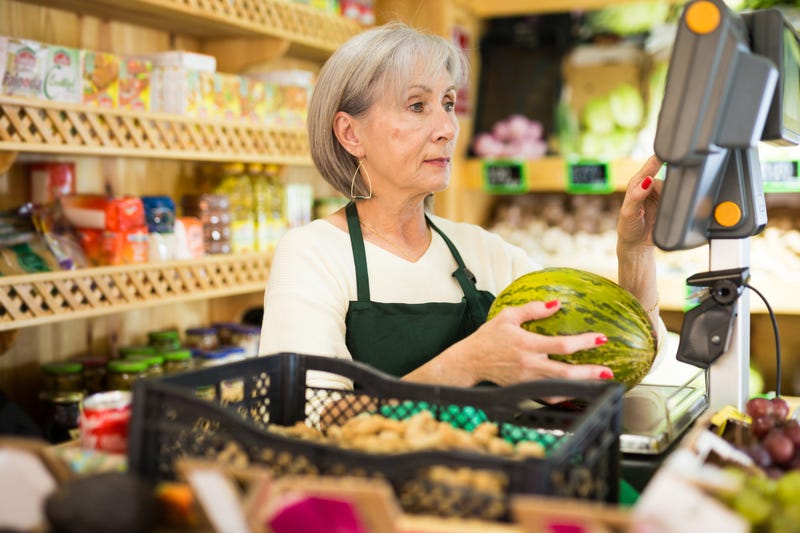 Mature woman cashier.