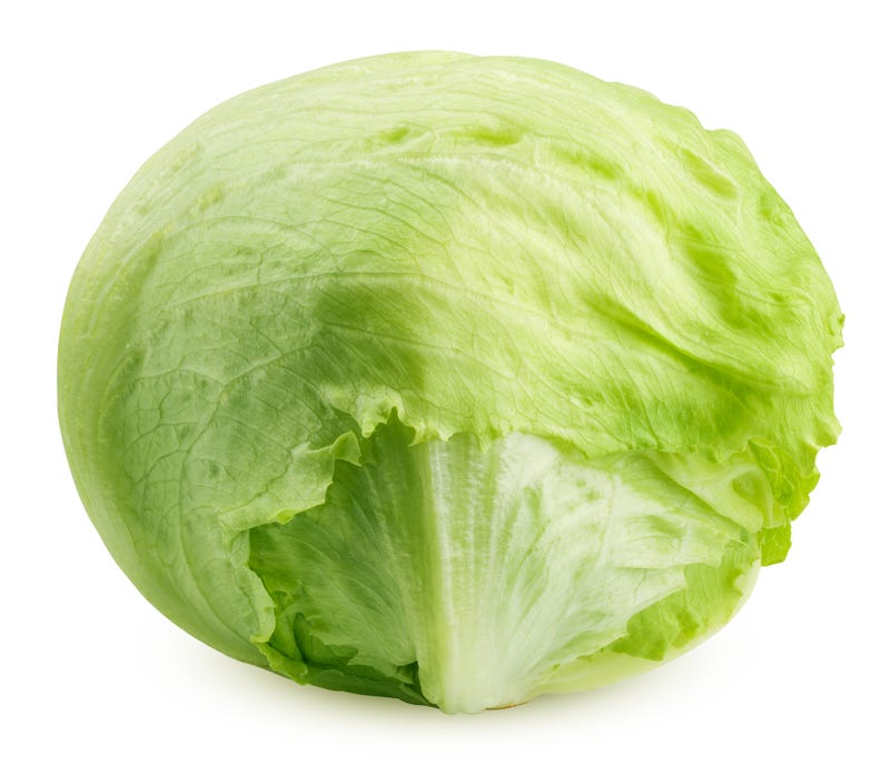 A head of romaine lettuce on a white background. 