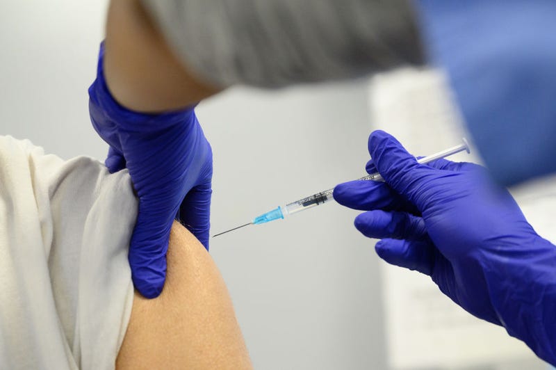 A woman receives her Covid-19 vaccination booster jab at the Sir Ludwig Guttmann Health & Wellbeing Centre on November 10, 2021 in the Stratford area of London, England.