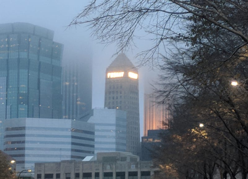 Even shrouded in fog and clouds, the iconic name "Foshay" shines bright among the giant glass and steel structures of downtown Minneapolis.