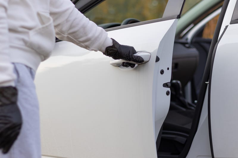 Person breaking into a car