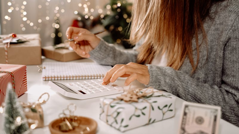 Person budgeting their holiday spending. 
