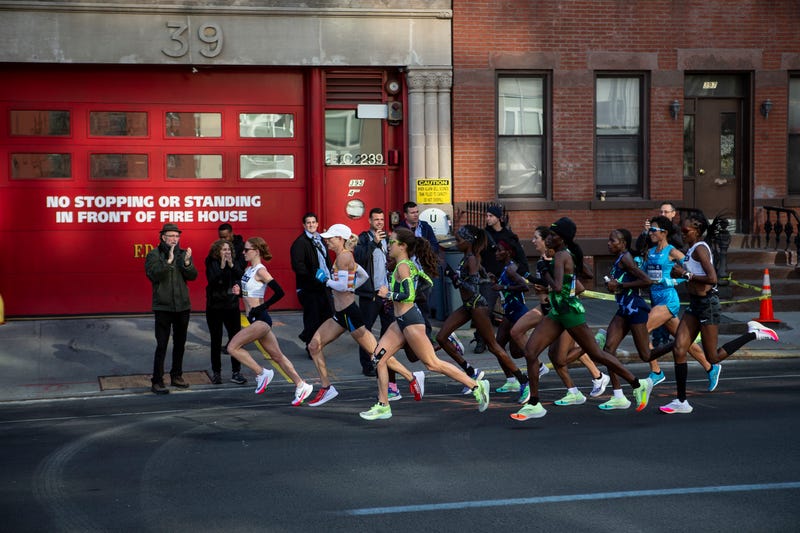 The lead pack of the women's race runs through Brooklyn during the 2021 TCS New York City Marathon in New York City.