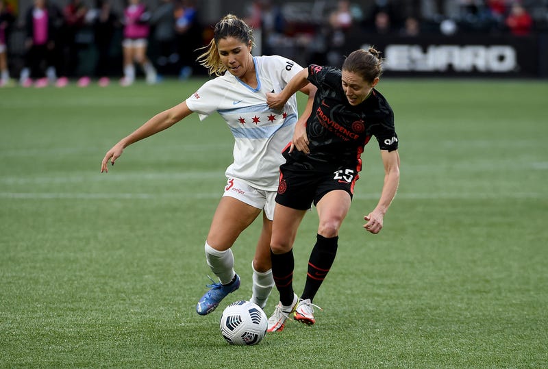 Katie Johnson #33 of Chicago Red Stars and Meghan Klingenberg #25 of Portland Thorns FC battle for a ball during the second half of the match at Providence Park on November 14, 2021 in Portland, Oregon. Chicago won 2-0.