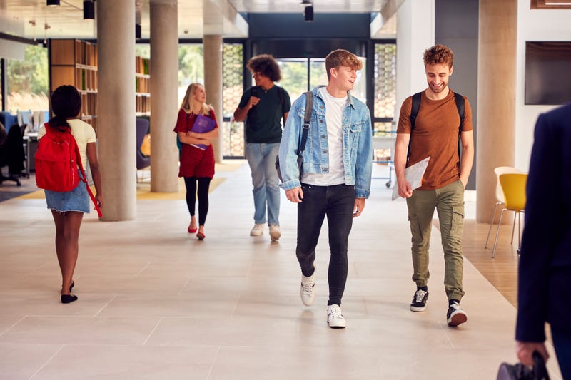 college students walk together