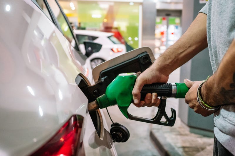 Man pumping gas into his car