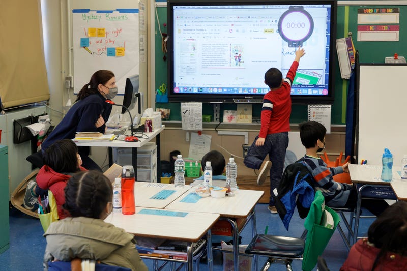 A teacher and students at a public school classroom in Manhattan