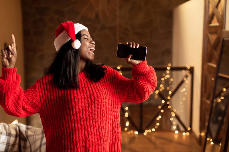 Person singing Christmas songs.