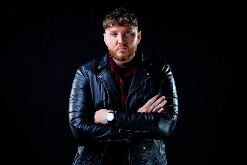 James Arthur folds his arms across his chest