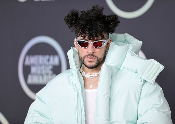 Singer Bad Bunny wearing sunglasses and a fluffy coat