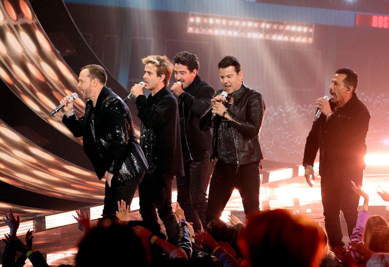 Donnie Wahlberg, Joey McIntyre, Jonathan Knight, Jordan Knight, and Danny Wood of New Kids on the Block perform onstage during the 2021 American Music Awards