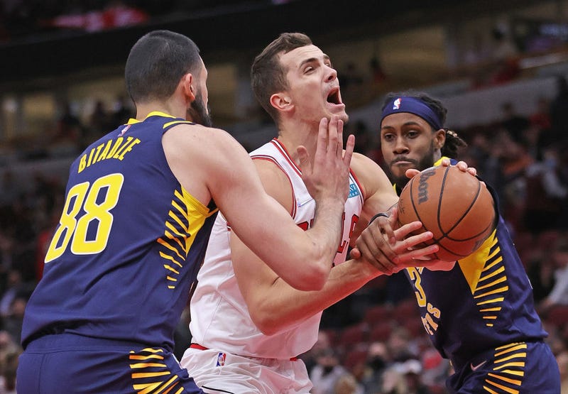 Marko Simonovic #19 of the Chicago Bulls tries to moves between Goga Bitadze #88 and Isaiah Jackson #23 of the Indiana Pacers at the United Center on November 22, 2021 in Chicago, Illinois. The Pacers defeated the Bulls 109-77.