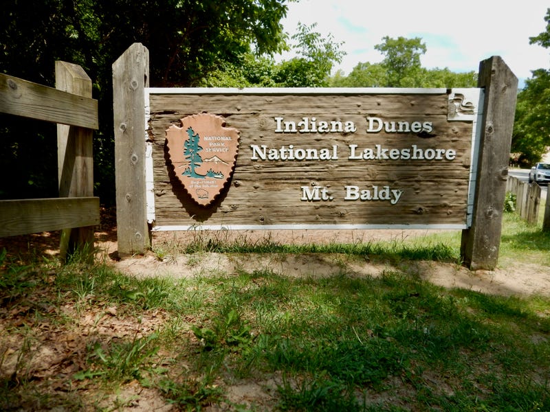 Indiana Dunes National Lakeshore park sign. Park officials said swarms of biting flies have been making some of its eastern beaches very uncomfortable for visitors.