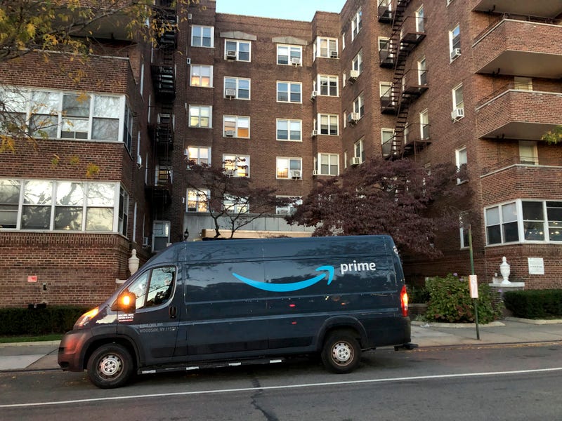 Amazon van parked in front of Queens apartment building. 