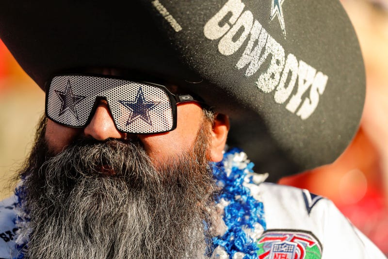 A Dallas Cowboys fan watches pregame warmups prior to the game between the Kansas City Chiefs and the Dallas Cowboys at Arrowhead Stadium on November 21, 2021 in Kansas City, Missouri.
