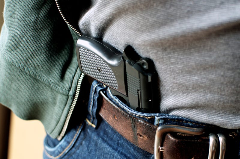 Man with a gun in his pants. 