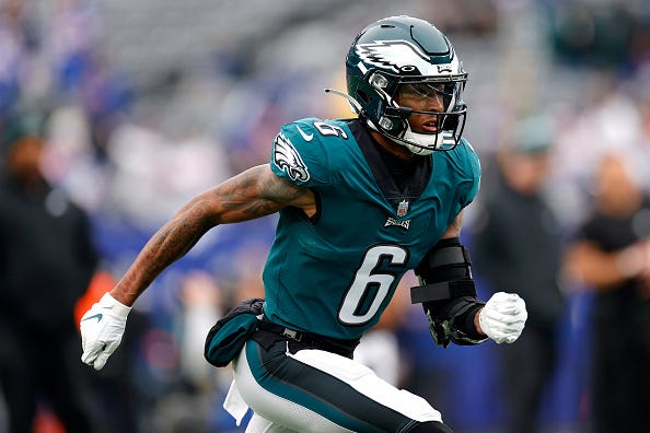 DeVonta Smith models the midnight green Eagles uniforms. 
