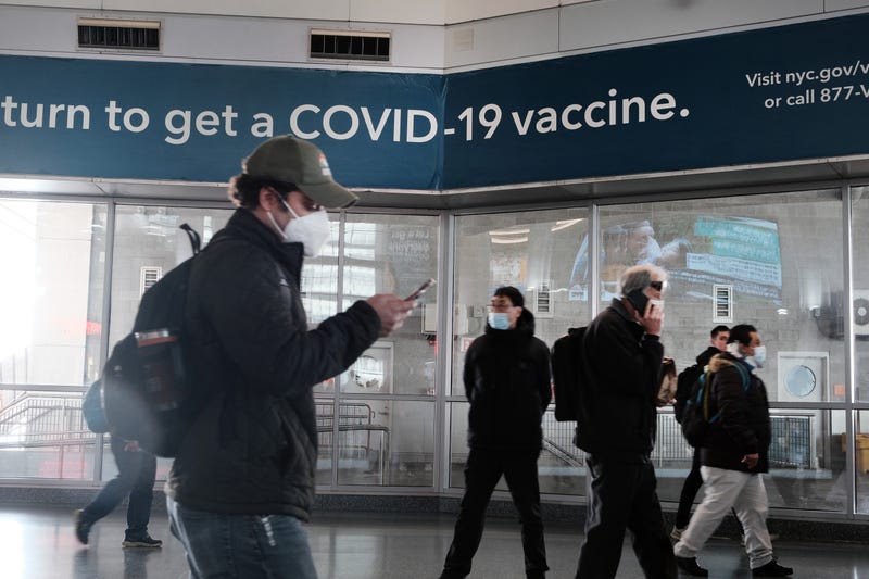 A sign urges people to get the Covid vaccine at the Staten Island Ferry terminal on Nov. 29, 2021 in New York City