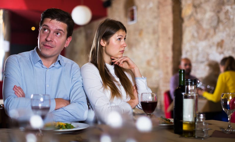 Couple stressed out on a date. 