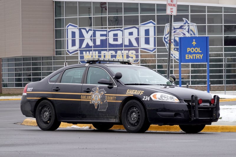 Oakland County Sheriff vehicle in front of Oxford High School 