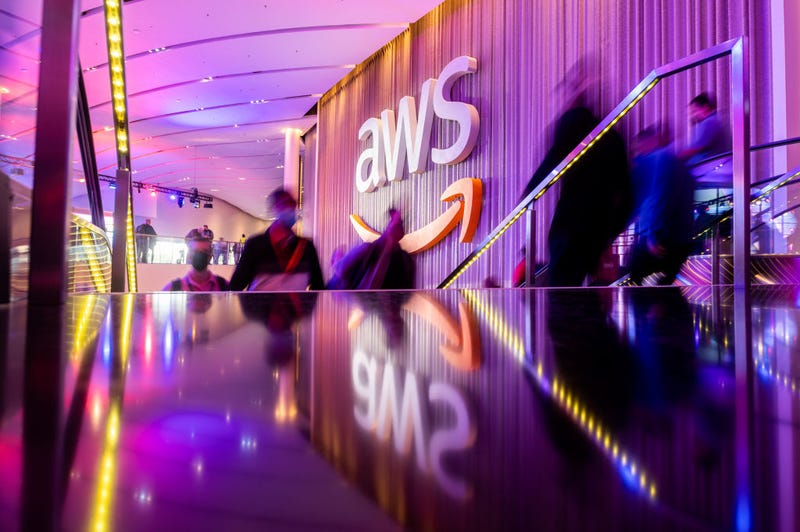 Attendees arrive during AWS re:Invent 2021, a conference hosted by Amazon Web Services, at The Venetian Las Vegas on November 30, 2021 in Las Vegas, Nevada. (Photo by Noah Berger/Getty Images for Amazon Web Services)