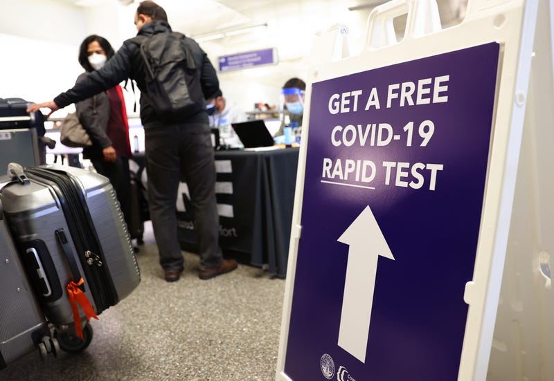 People who arrived on international flights wait to be tested on the first day of a new rapid COVID-19 testing site for arriving international passengers at Los Angeles International Airport (LAX) on December 3, 2021 in Los Angeles, California. 