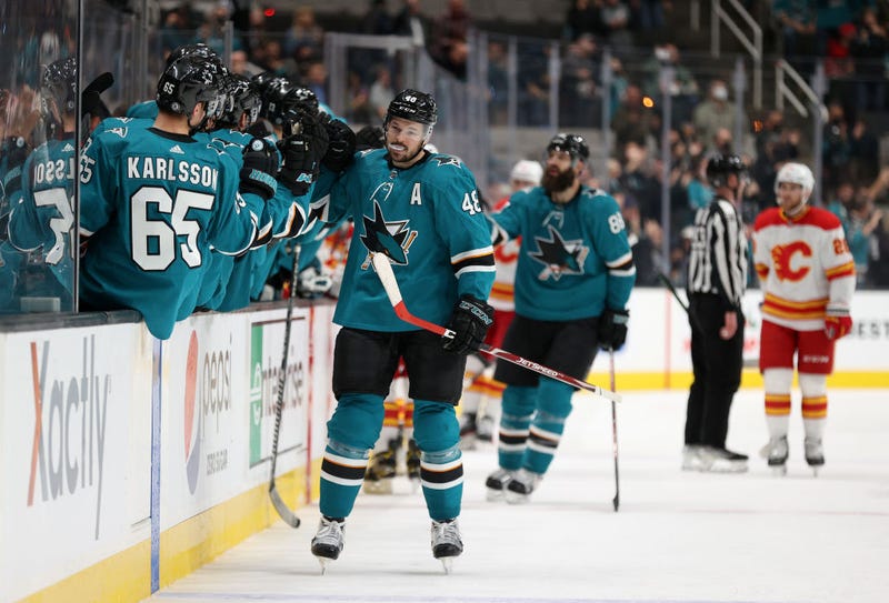 Tomas Hertl #48 of the San Jose Sharks is congratulated by teammates after he scored in the first period against the Calgary Flames at SAP Center on December 07, 2021 in San Jose, California.